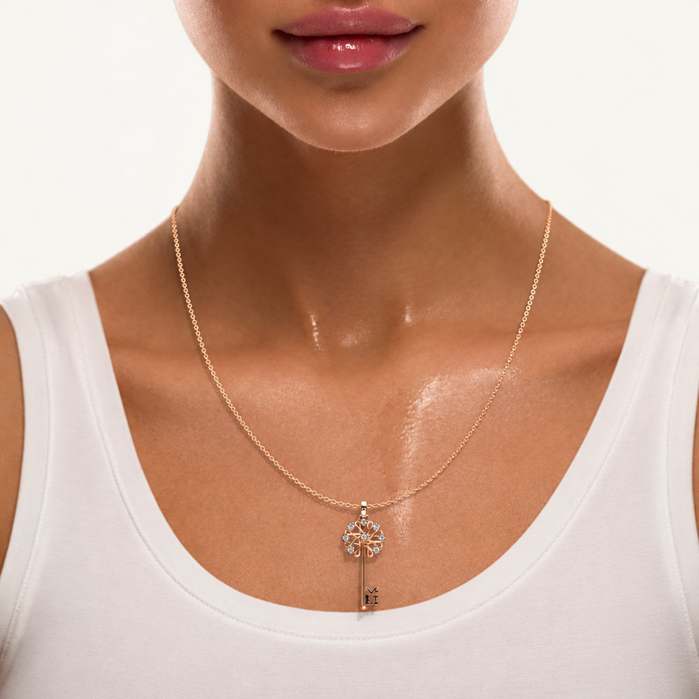 Everbell Key Pendant in 18K rose gold with diamonds — worn on model