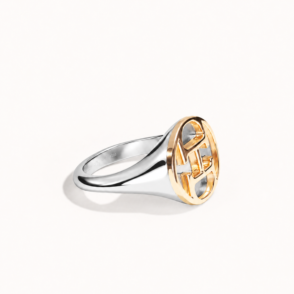 AHO Monogram Ring, polished sterling silver and 18K gold, angle view