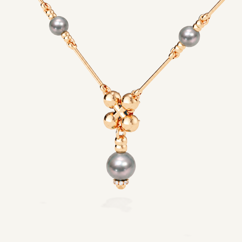 Barbelle necklace with grey Tahitian pearls, London blue topaz and mandarin garnets — rear view