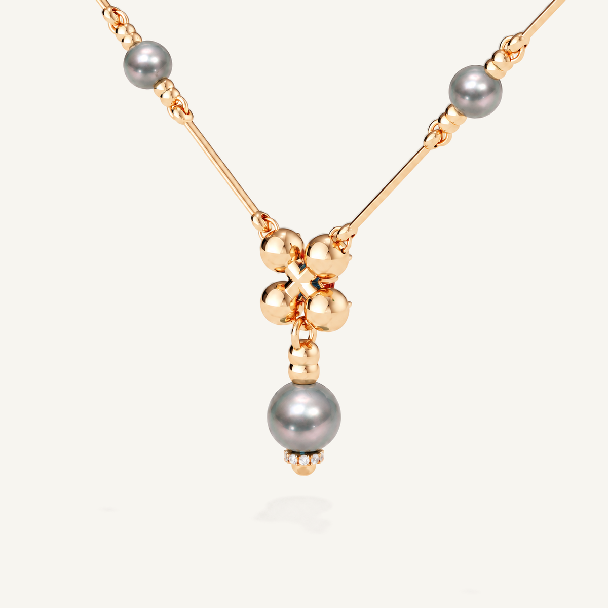 Barbelle necklace with grey Tahitian pearls, London blue topaz and mandarin garnets — rear view