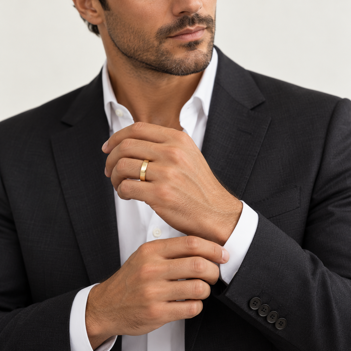 BASTION 5 mm — male model wearing an 18K yellow gold wedding band, AI model illustration