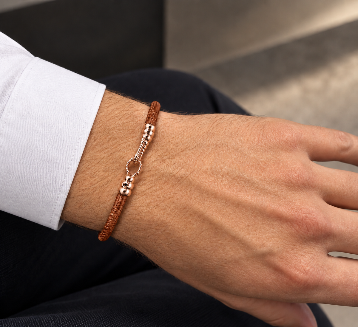 Molekule Hook Bracelet in Tobacco Brown European calfskin with 9K rose gold hook, worn on the wrist