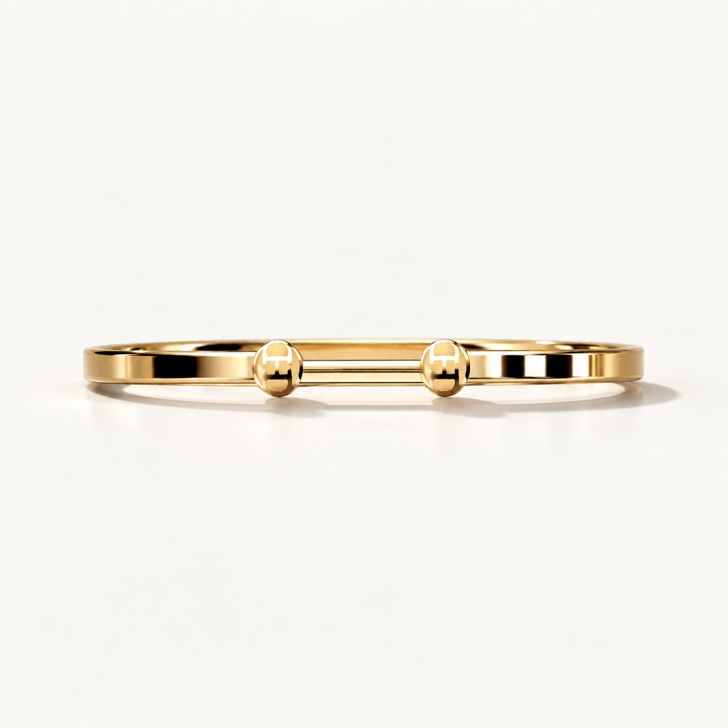 Open Monogram Frame Cuff in polished 18K yellow gold, front view