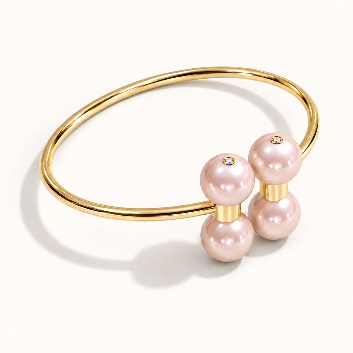 Barbelle Couple Bangle in 18K yellow gold with Pink Freshwater Pearl — angle view