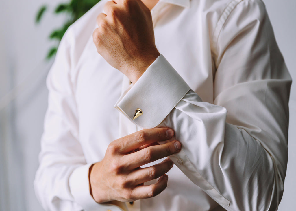 Les Griffe Cufflinks in 18K rose gold, worn on a model