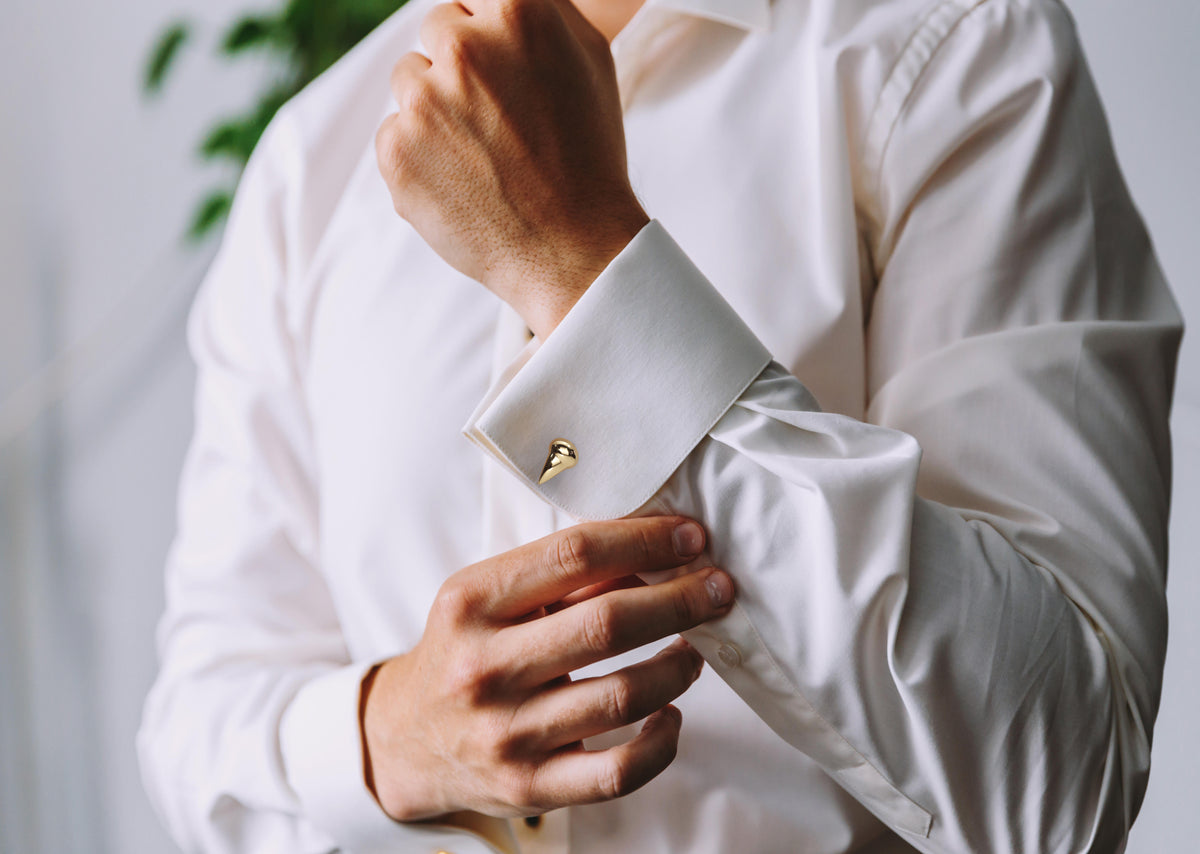 Les Griffe Cufflinks in 18K rose gold, worn on a model