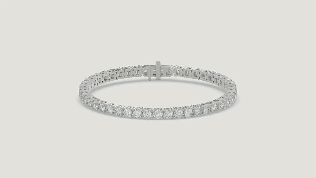 Basket 4 Prong Diamond Tennis Bracelet in 18K white gold on a warm studio background