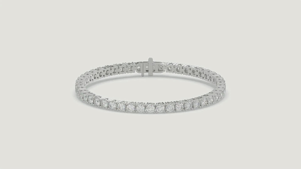Basket 4 Prong Diamond Tennis Bracelet in 18K white gold on a warm studio background