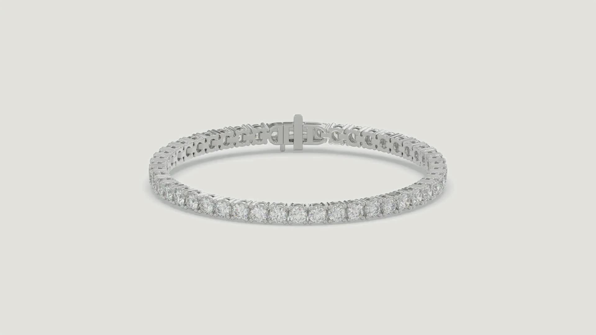 Basket 4 Prong Diamond Tennis Bracelet in 18K white gold on a warm studio background
